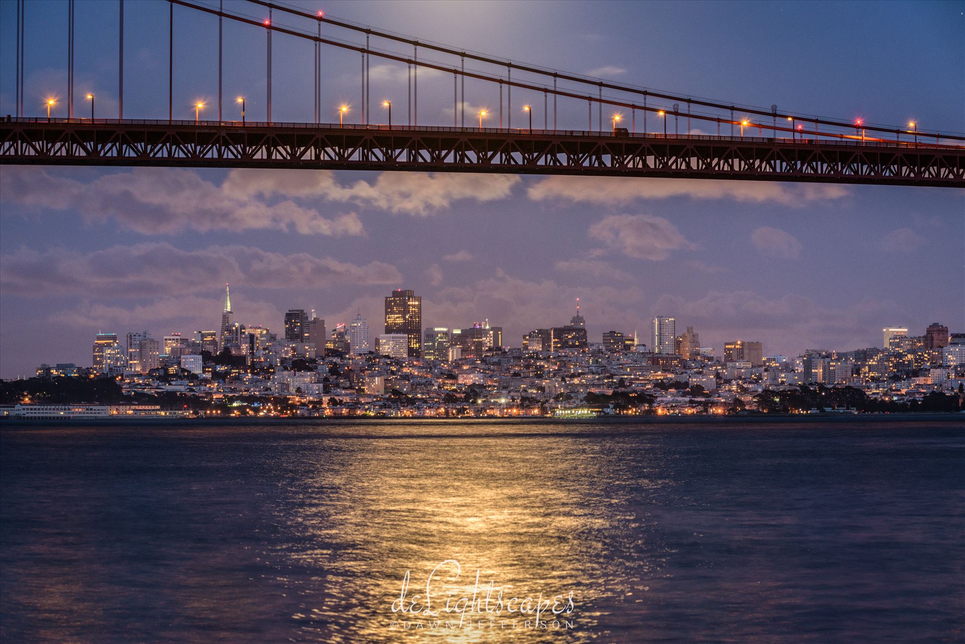 San Francisco by Moonlight - A full moon rises above the Golden Gate Bridge illuminating the San Francisco skyline. by Dawn Jefferson
